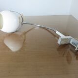 Eye ball lamp stapled on a chrome hose 70s
