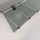 Table basse vintage en verre fumé, métal noir et fonte d’aluminium