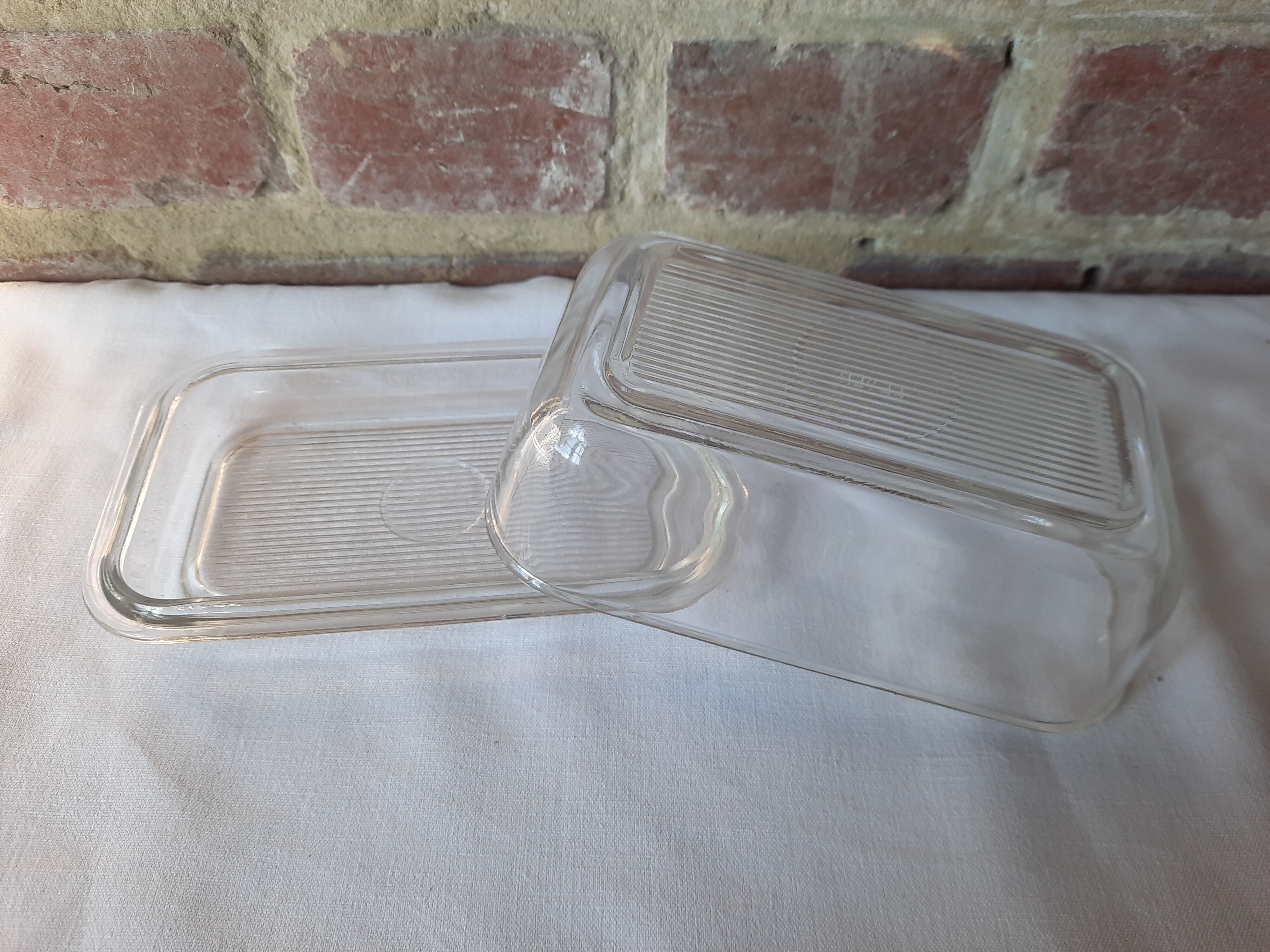 Transparent glass butter dish from lever