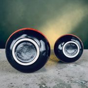 A pair of black and red spherical vases by Bay Keramik, West Germany, from the 1960s.
