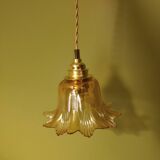 Amber tulip glass portable lamp, golden braided cord.