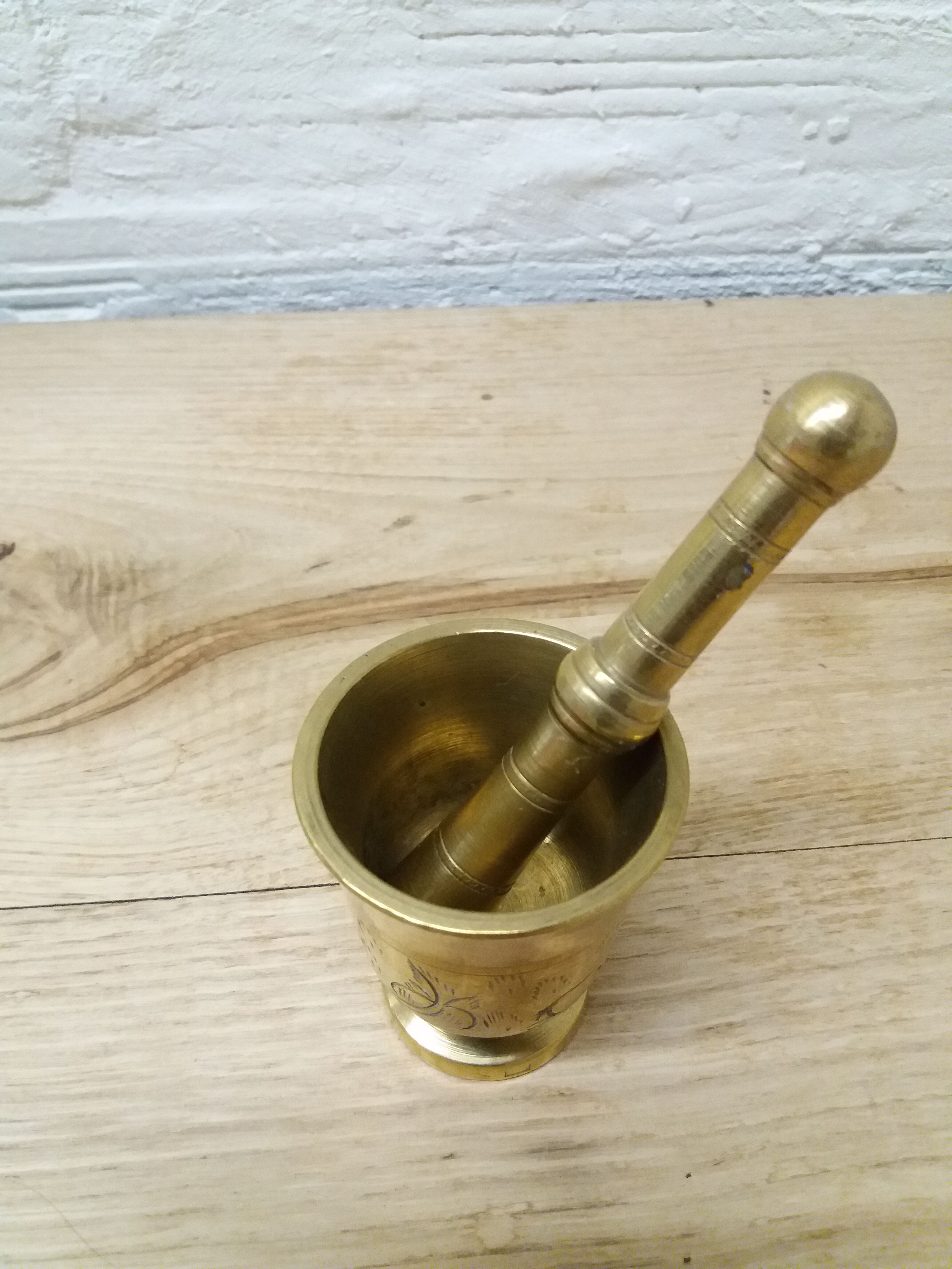 Golden brass mortar and pestle