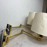 Two wall lights with articulated arm in gold metal Egolux