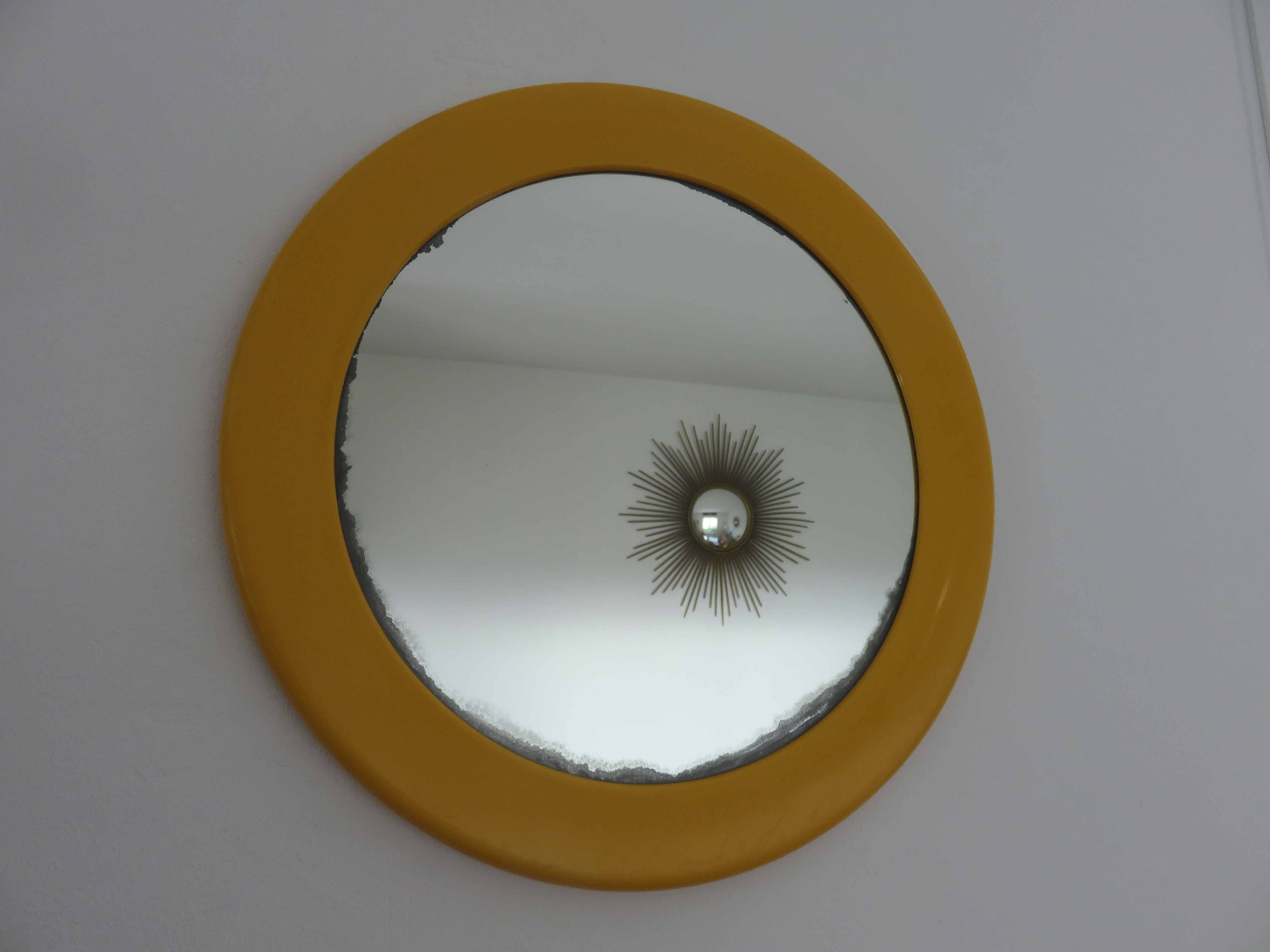 Round wall mounted mirror in yellow plastic 1970