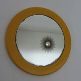 Round wall mounted mirror in yellow plastic 1970