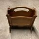 Vintage wicker newspaper rack