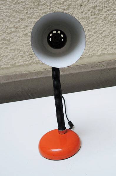 Old orange enameled sheet metal lamp