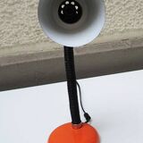 Old orange enameled sheet metal lamp