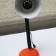 Old orange enameled sheet metal lamp