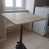 Bistro table with cast iron and white marble legs