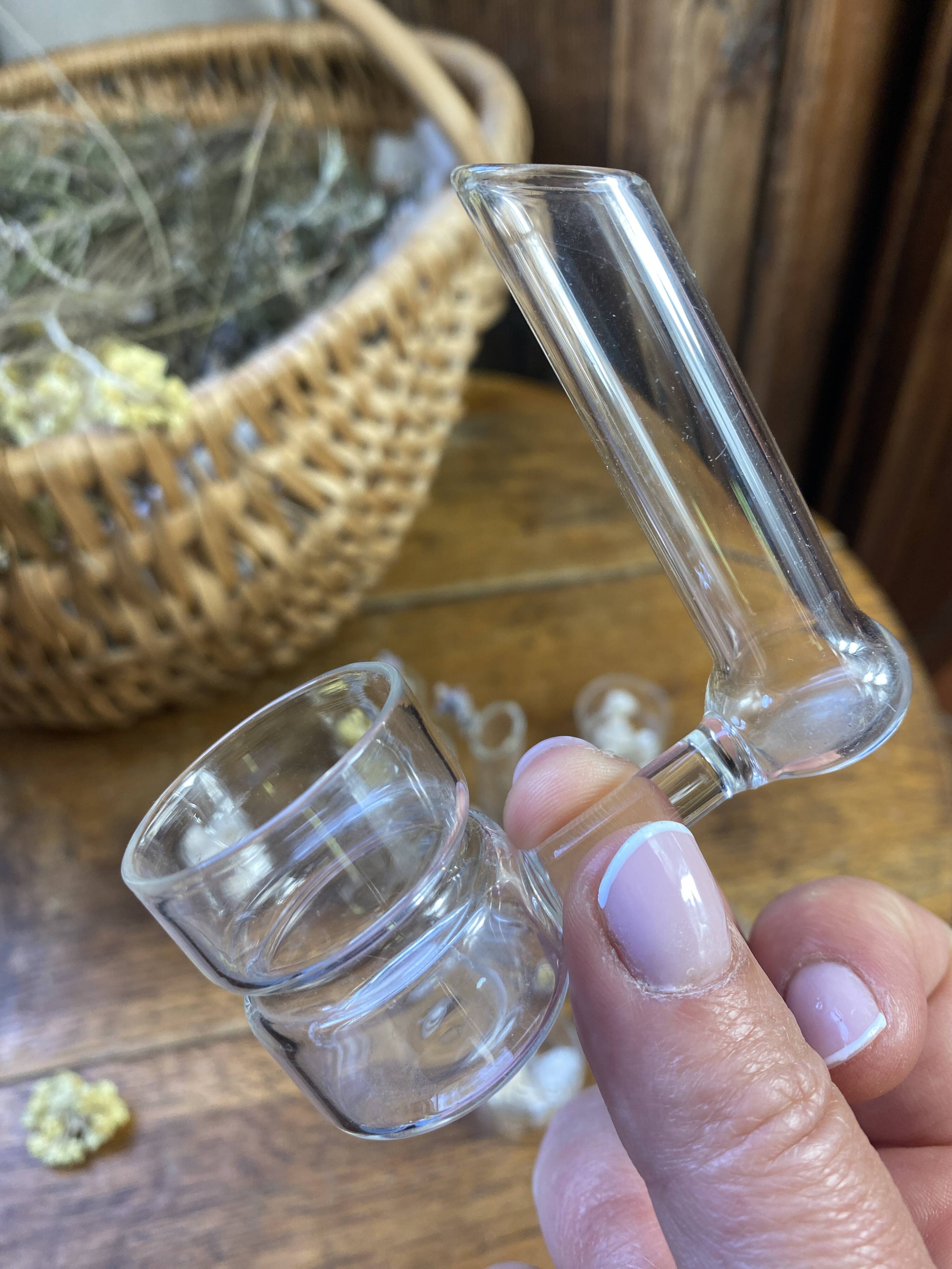Knife rests, flower vases and candle holders in blown glass.