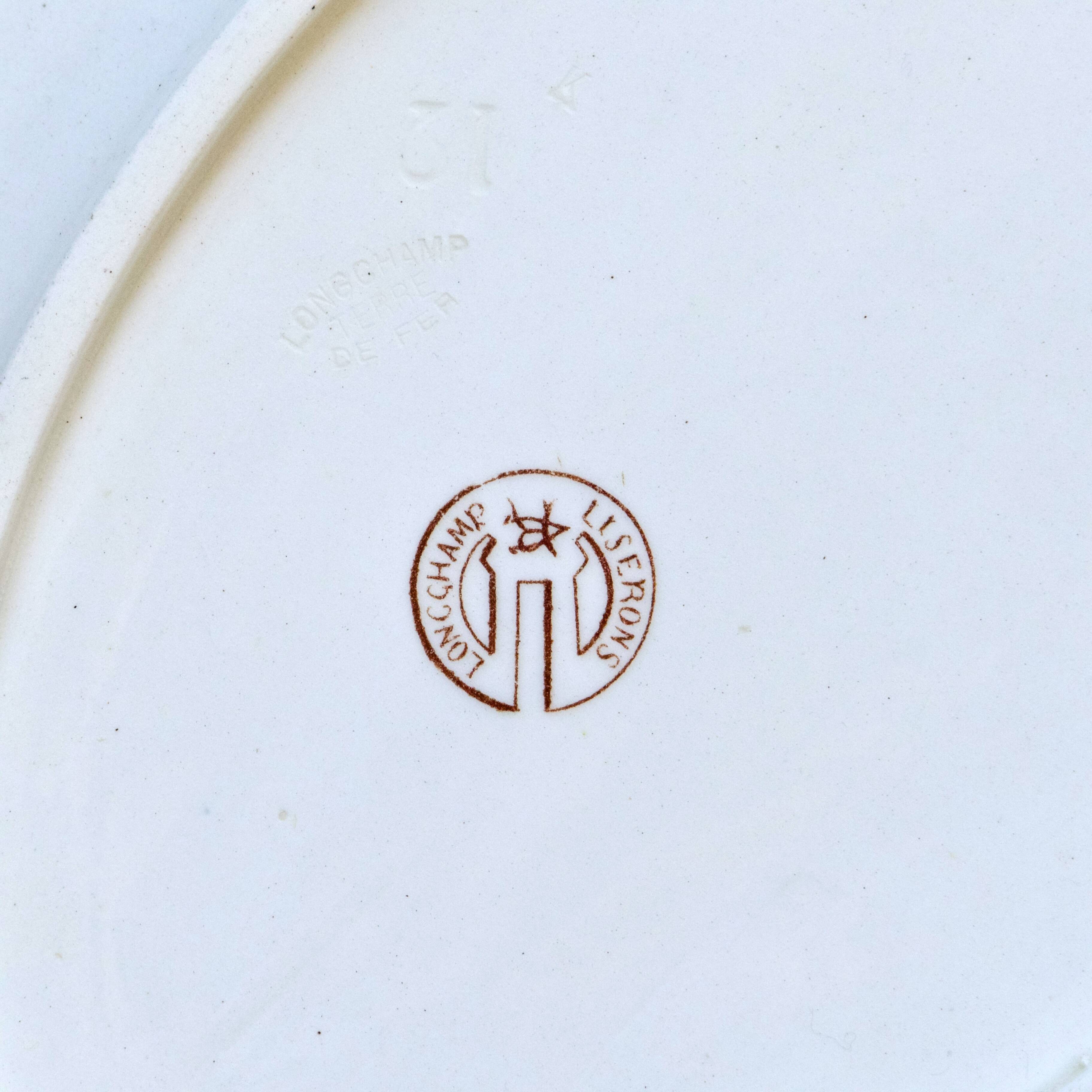 Oval dish from the 19th century in ironstone signed Longchamp "Liserons"