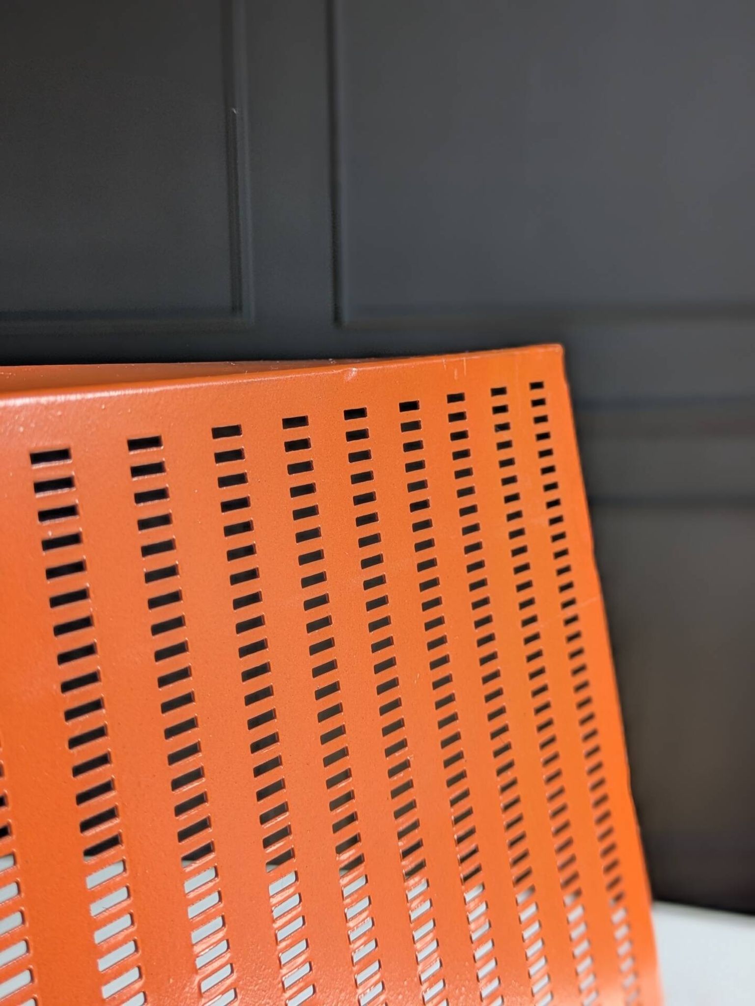 Vintage metal magazine rack in perforated orange/Mathieu Mategot style/70s