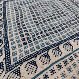 White and blue handwoven rug in natural wool