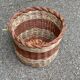 Round woven wicker basket in two colours