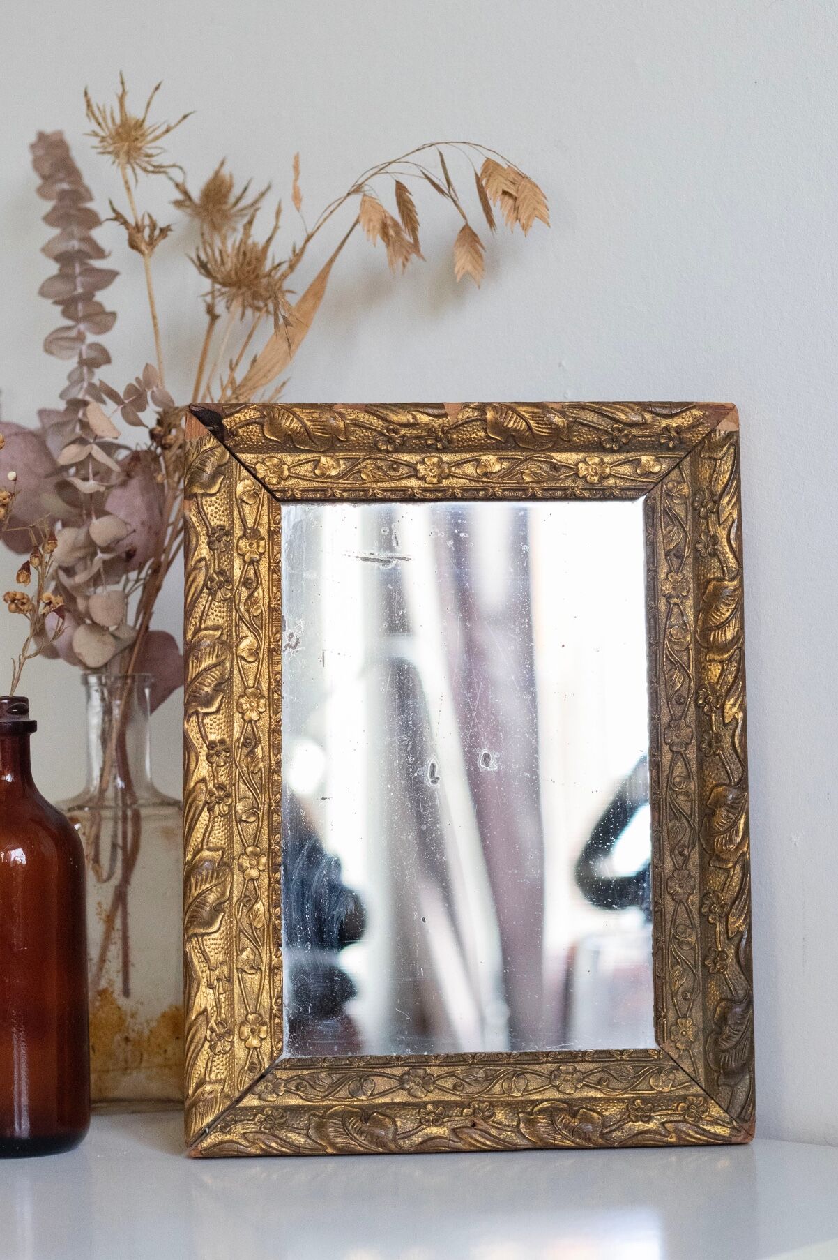 Antique mirror in gilded wood