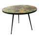 Round coffee table above resin flower decoration