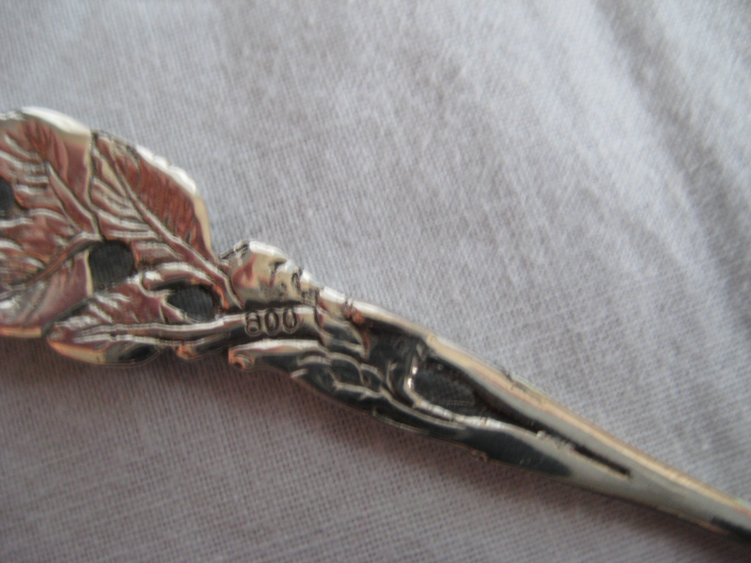 silver metal sugar and silver sugar spoon.