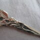 silver metal sugar and silver sugar spoon.