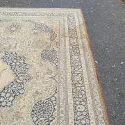 Large Persian wool rug 250x350 cm in gold and navy blue.