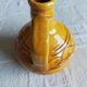 Round ochre glazed jug with handle