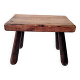 Old small solid wood milking stool
