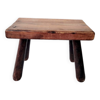 Old small solid wood milking stool