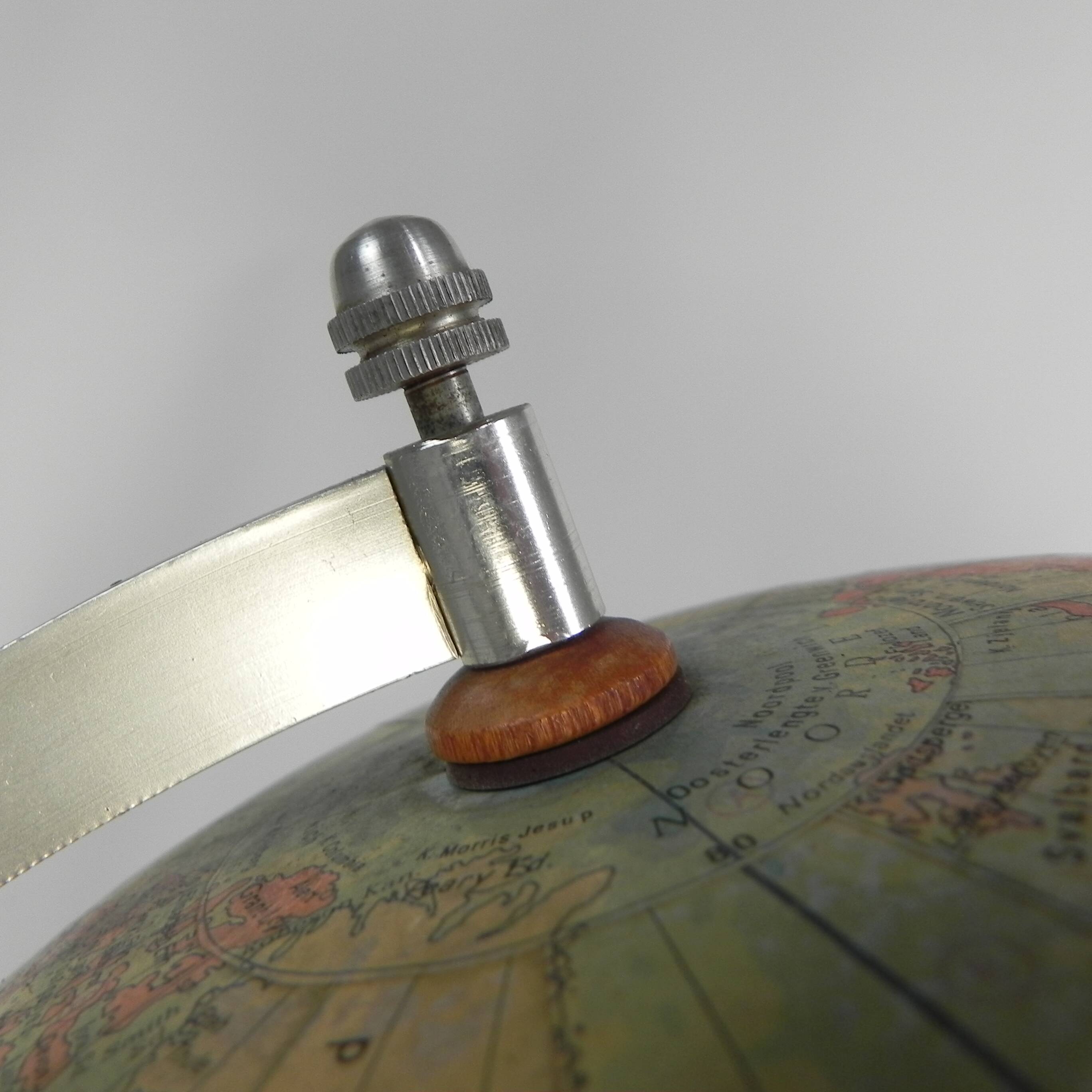Paper mache globe on a wooden base, 1975