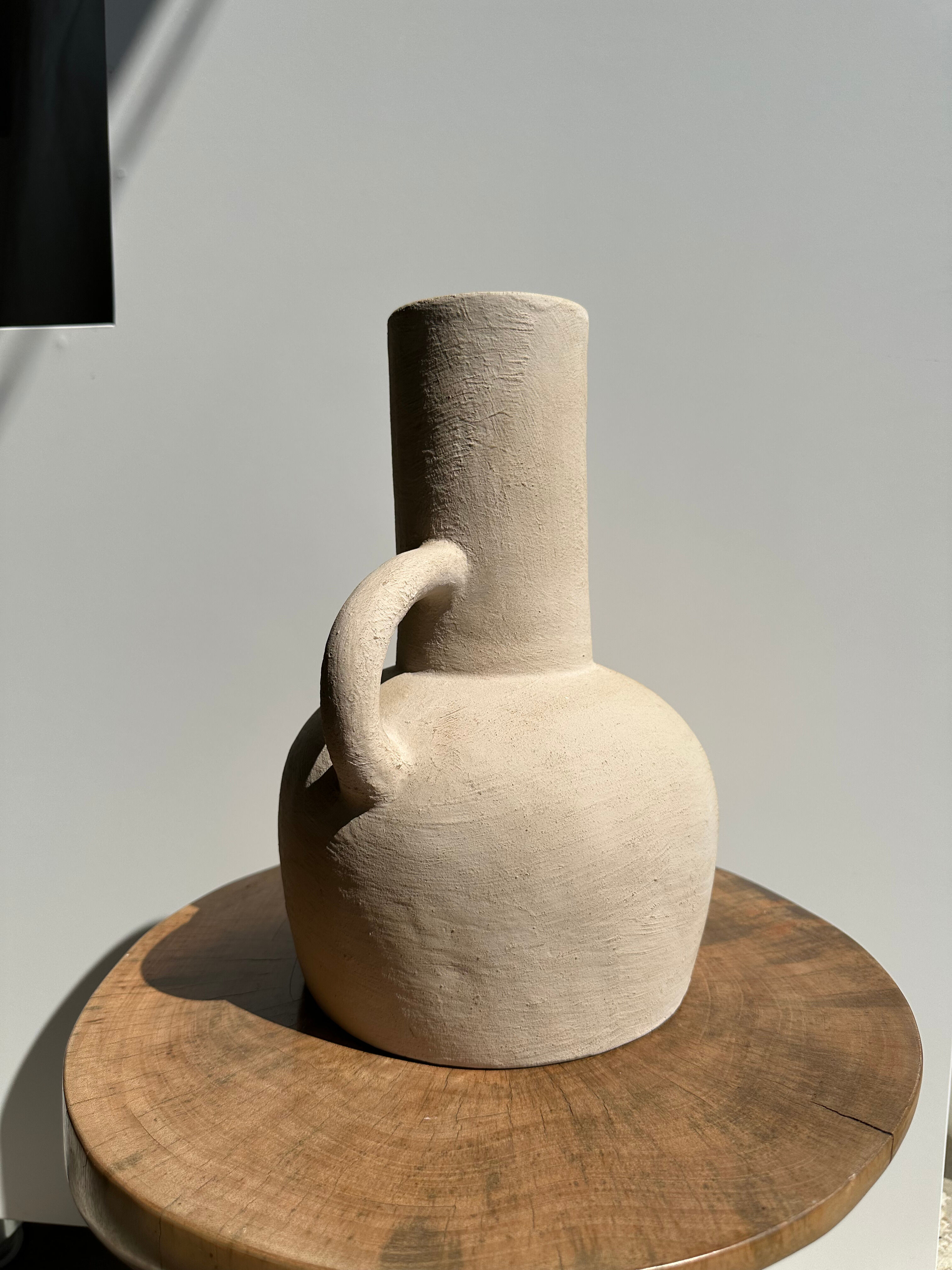 Handmade terracotta vase painted in beige with double handles h:32 d:25