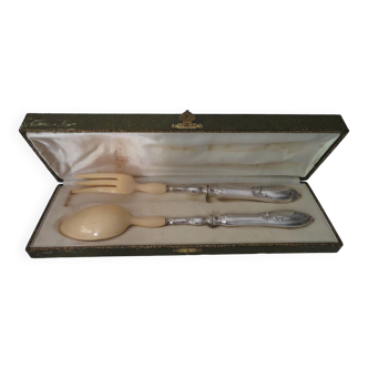 Silver salad cutlery stuffed into its case