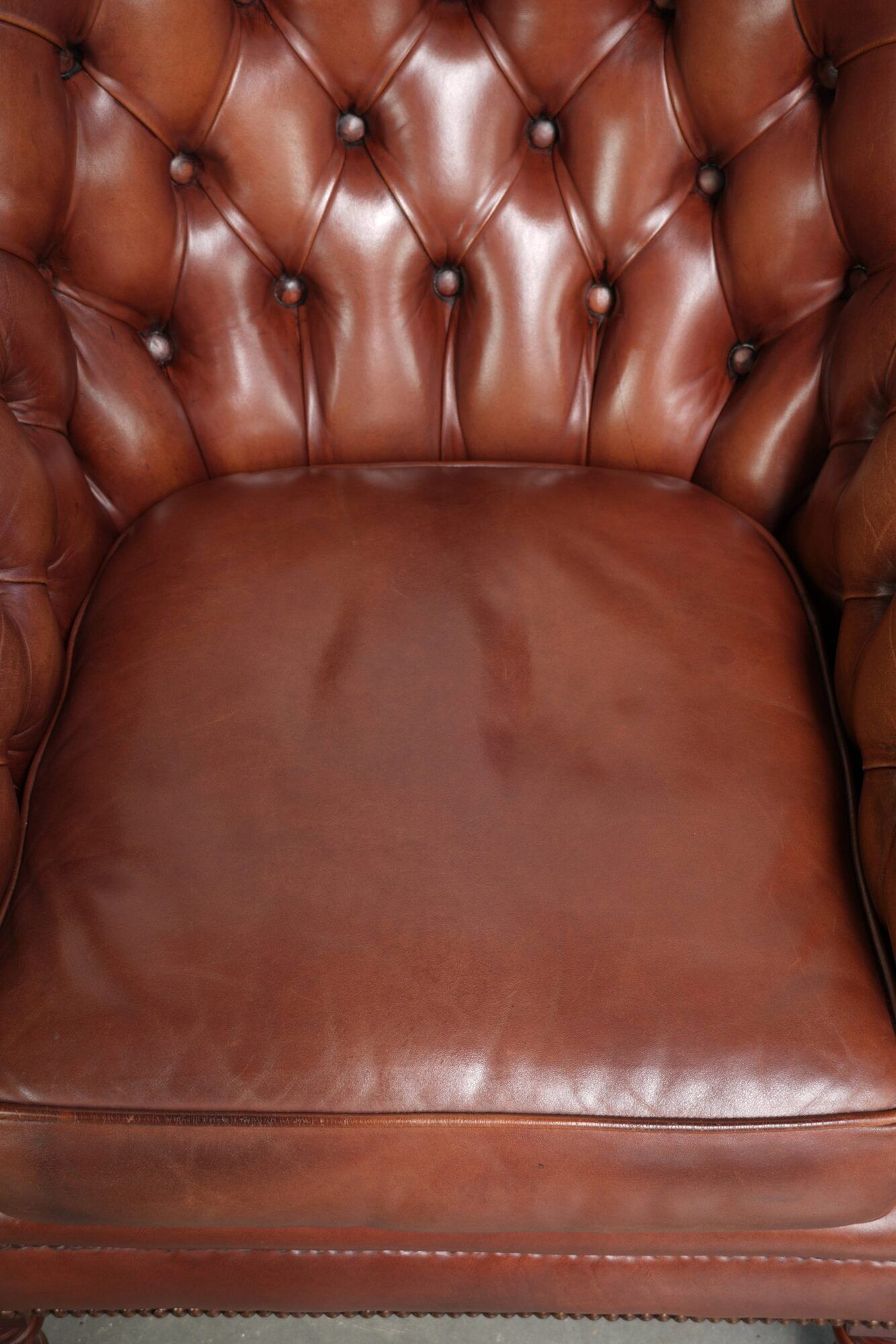Cognac-coloured cow leather Chesterfield armchair in English style