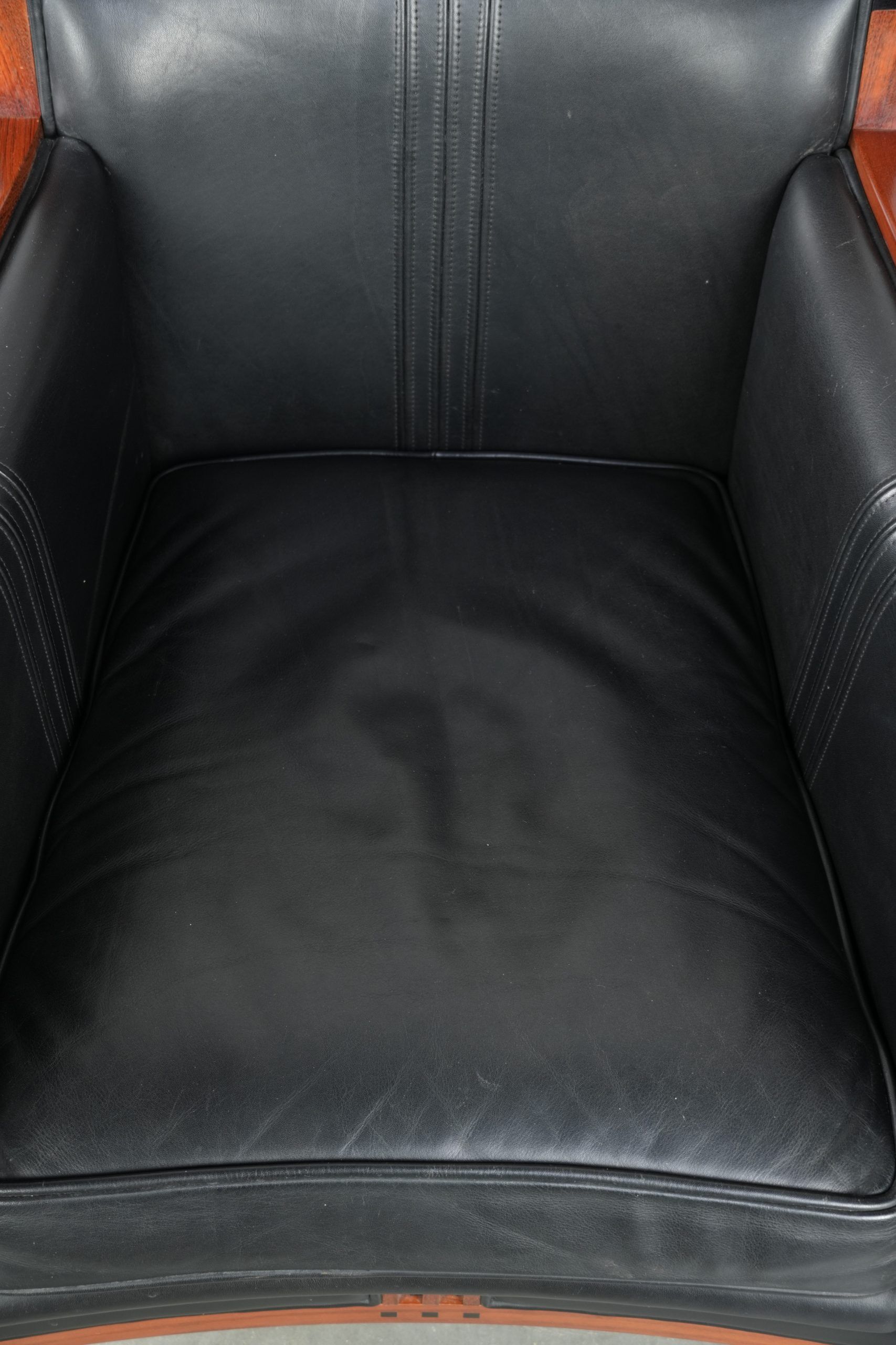 Black leather and wooden Art Deco design armchair