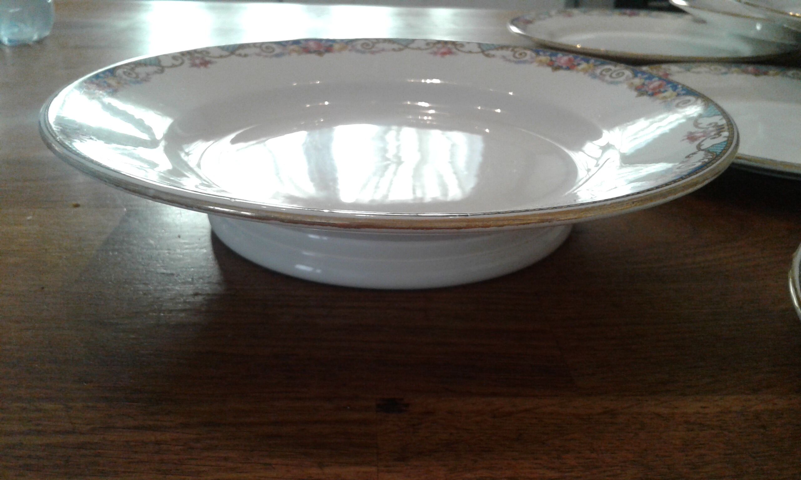 9 dessert plates and heel plate. sarreguemines,flower decirs