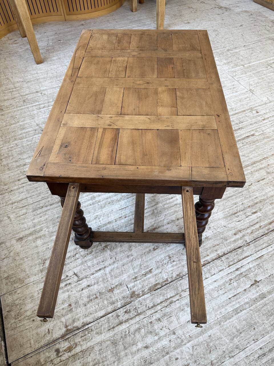 Paneled walnut desk with turned legs, 1900