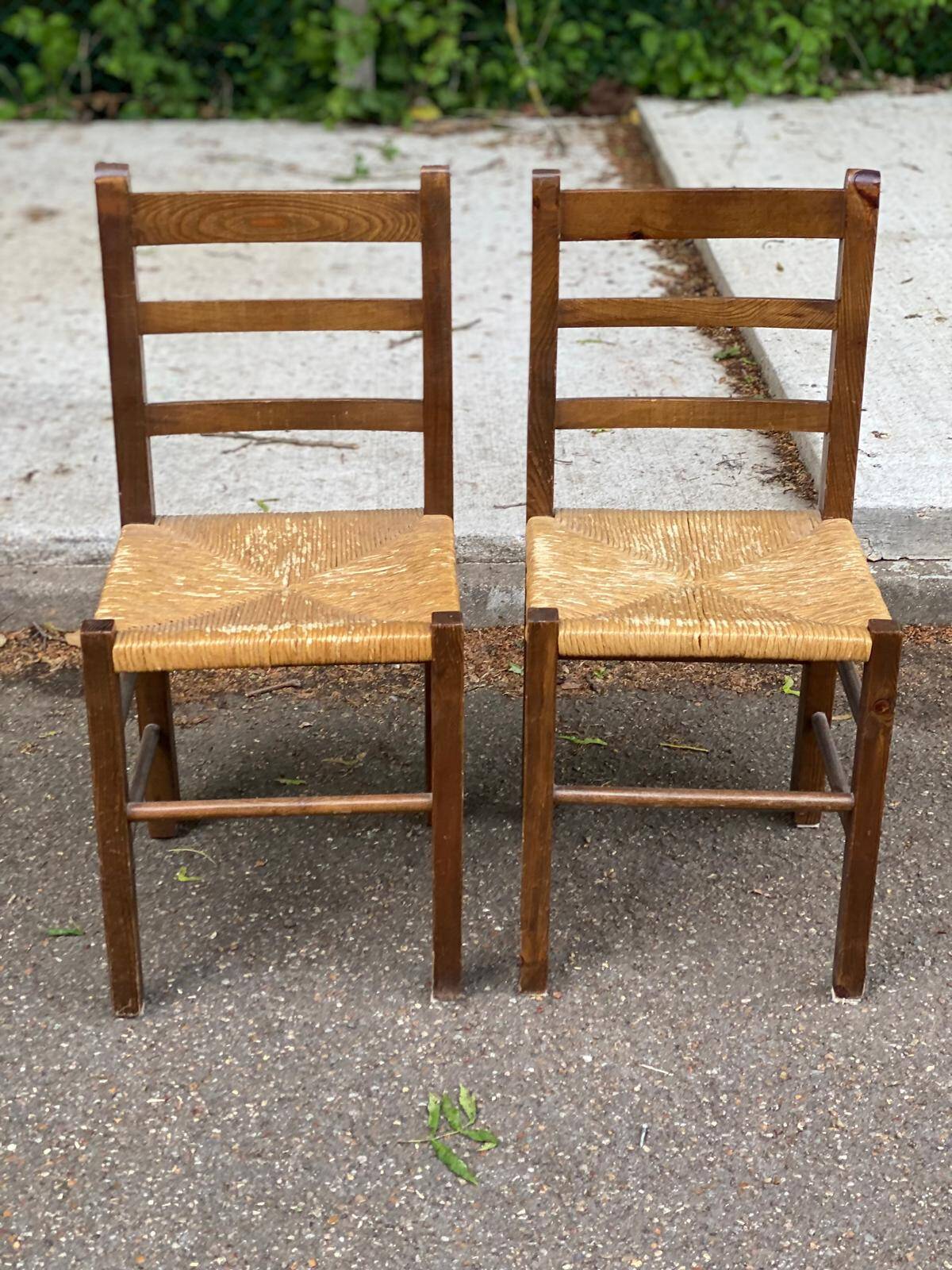 2 solid wood and straw chairs