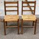 2 solid wood and straw chairs