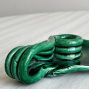Vintage green glazed ceramic candle holder, organic design.