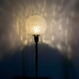 Table lamp with an antique textured glass globe