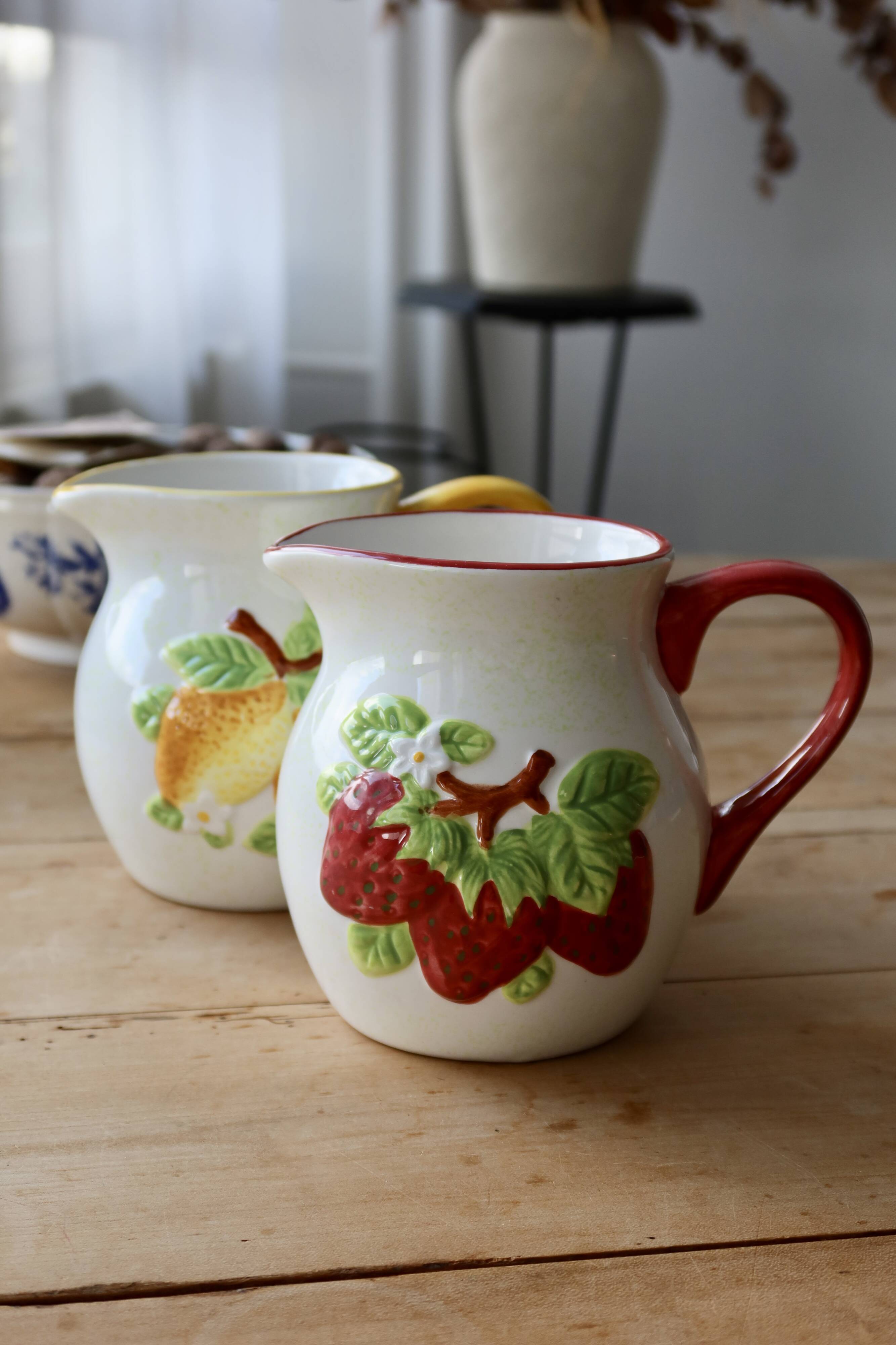 Vintage earthenware and slip pitcher with lemon motif