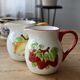 Vintage earthenware and slip pitcher with lemon motif