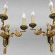 Pair of gold bronze wall lights in Empire style with three lights "Lucien Gau"