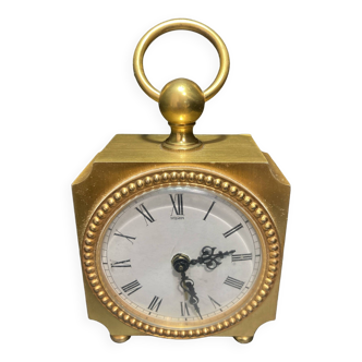Alarm clock in gold metal