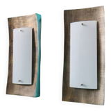 Pair of wall sconces in gold-plated alloy with bas-relief and opaline glass. Germany, 1980