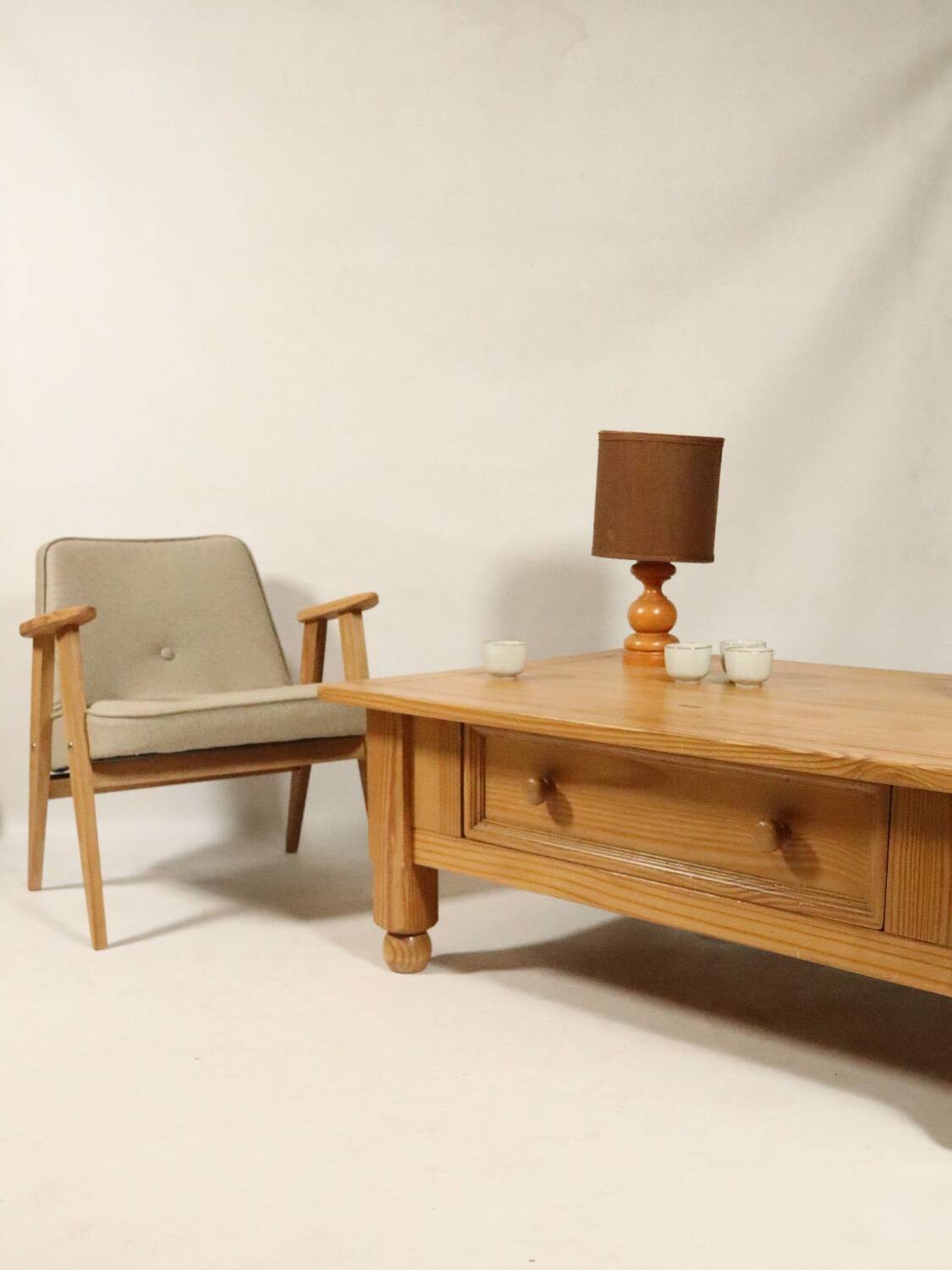 Rustic vintage style coffee table in light wood, mid-century modern design.