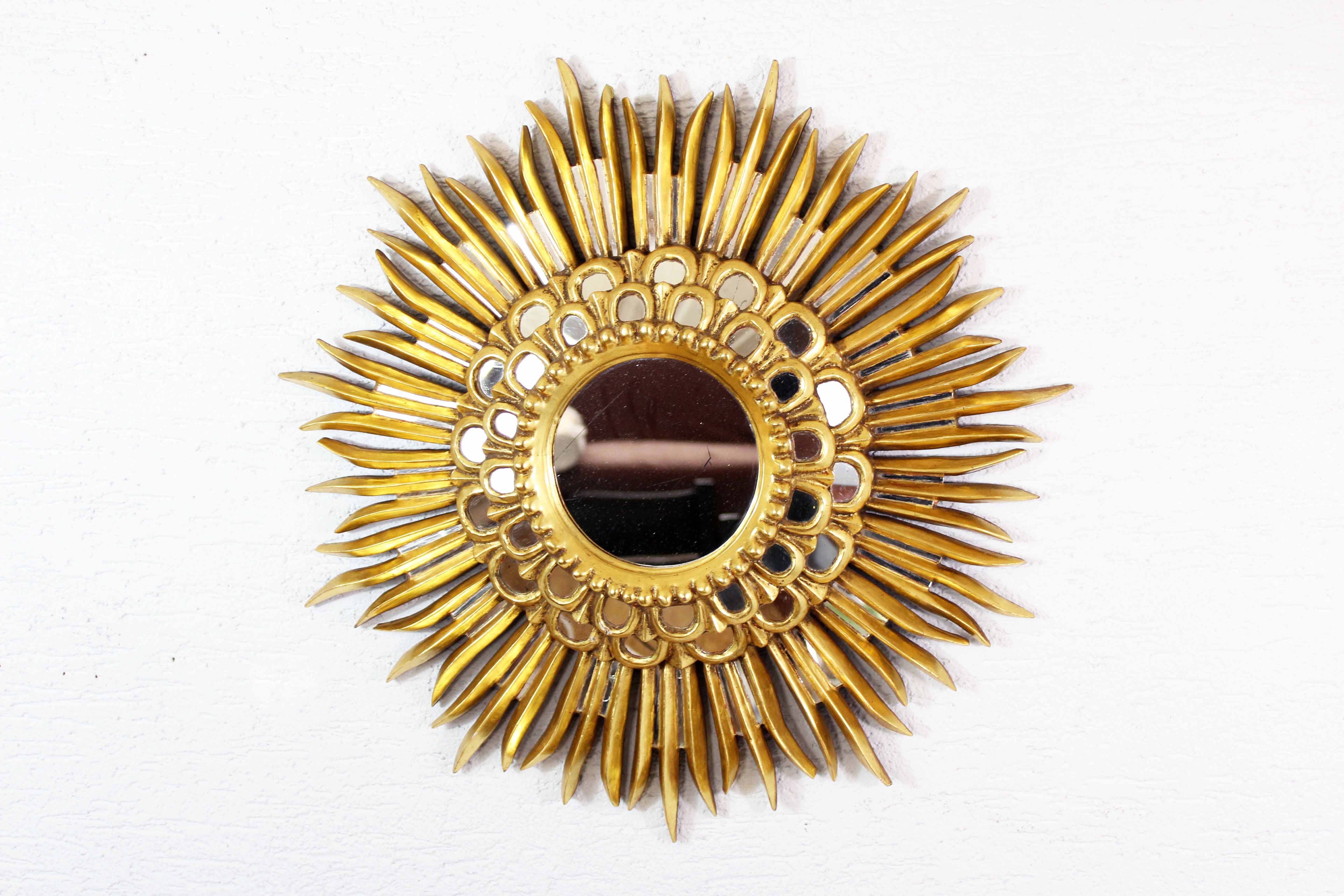 Sun mirror in wood and gilded stucco