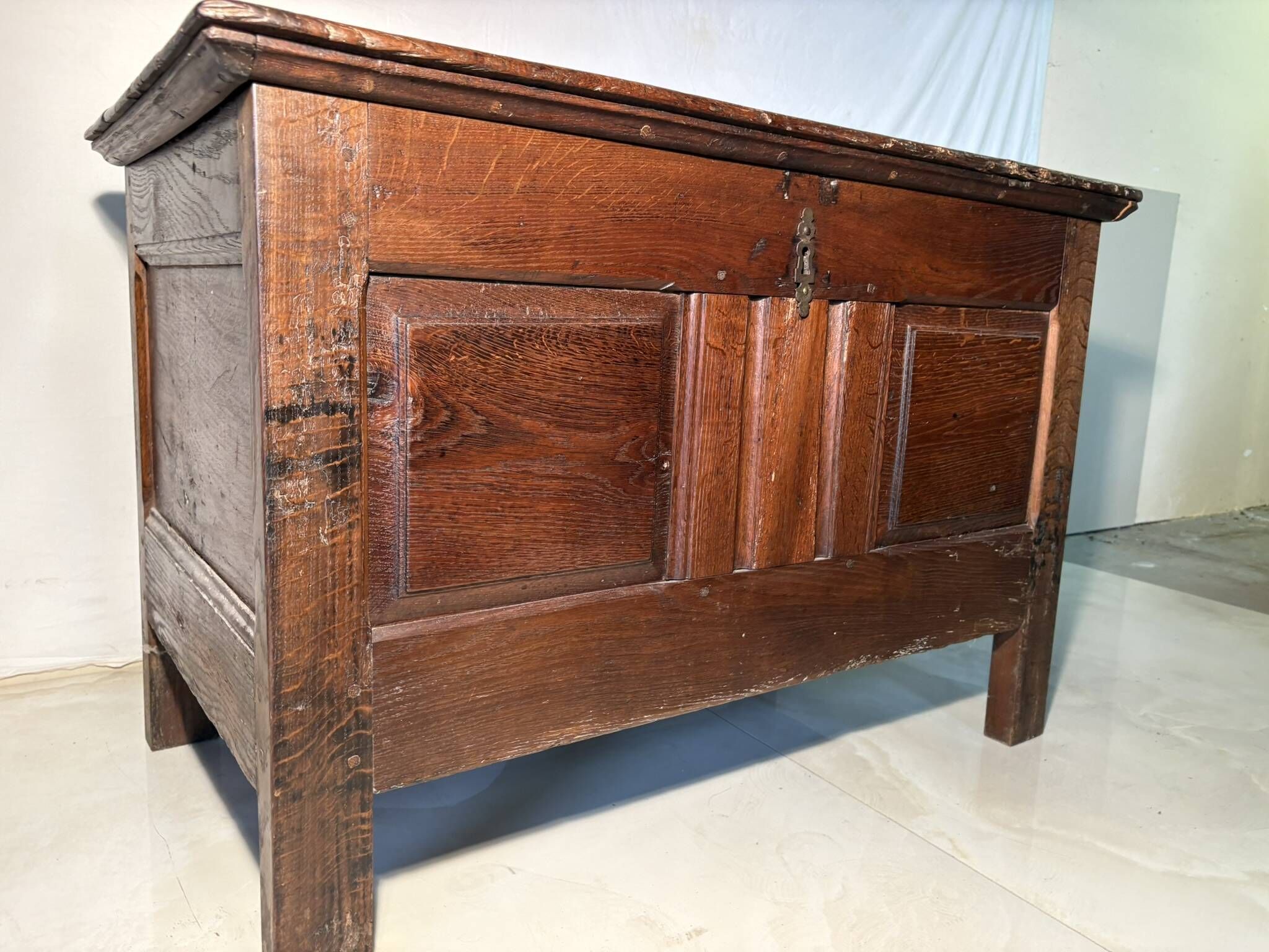 Rustic antique oak chest, original fittings and moulded panels.