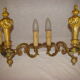 pair of bronze wall lights with 2 arms