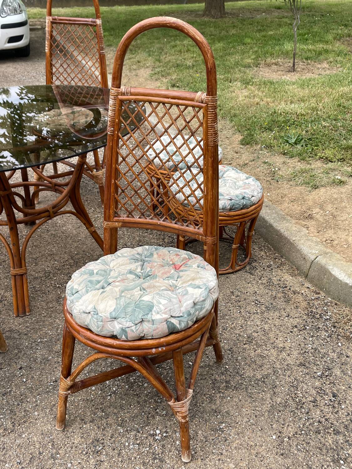 Vintage rattan dining set with glass table, 4 chairs and 4 stools.