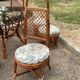 Vintage rattan dining set with glass table, 4 chairs and 4 stools.