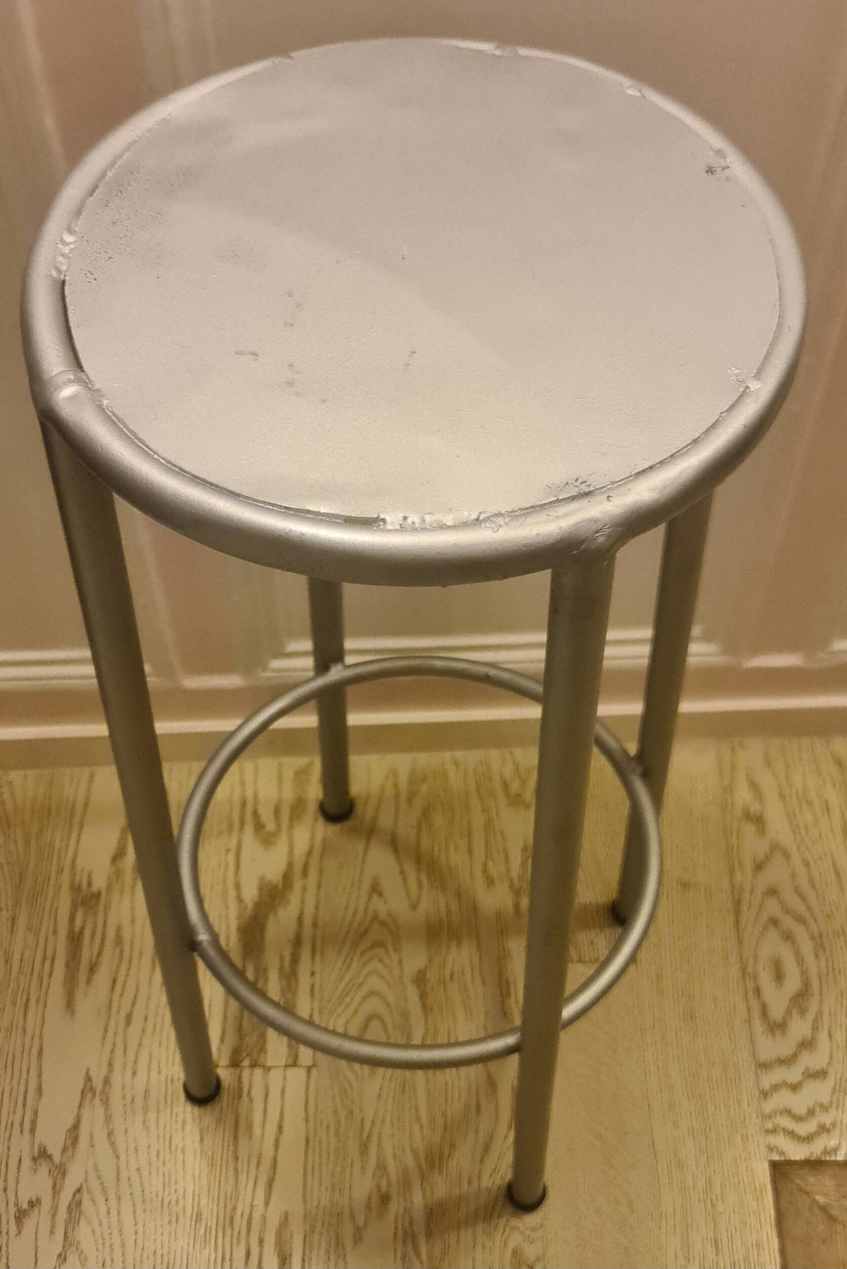 Old industrial iron stool repainted metallic gray in perfect condition